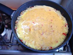 Cooking quiche just prior to covering with foil.