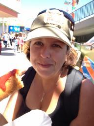 Rosie with an excellent corn dog at the  Santa Cruz Beach Boardwalk.