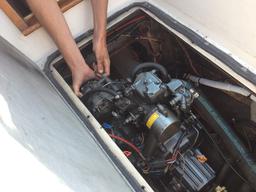 Reinstalling the alternator - that's the thingy in my right hand