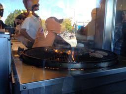 Harburgers restaurant; that grill is spinning slowly.  Notice the people in line on the right side of the photo.  Sorry for the glare!
