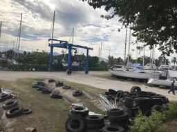 Crazy Love on the travel lift going from the haulout ramp to the pit