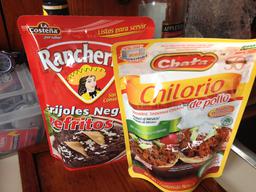 Pouches of refried beans and chicken.