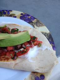 Served on top of a quesadilla of the cheese variety.