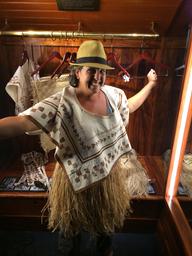 Rosie exploring native clothing at the Bishop Museum.